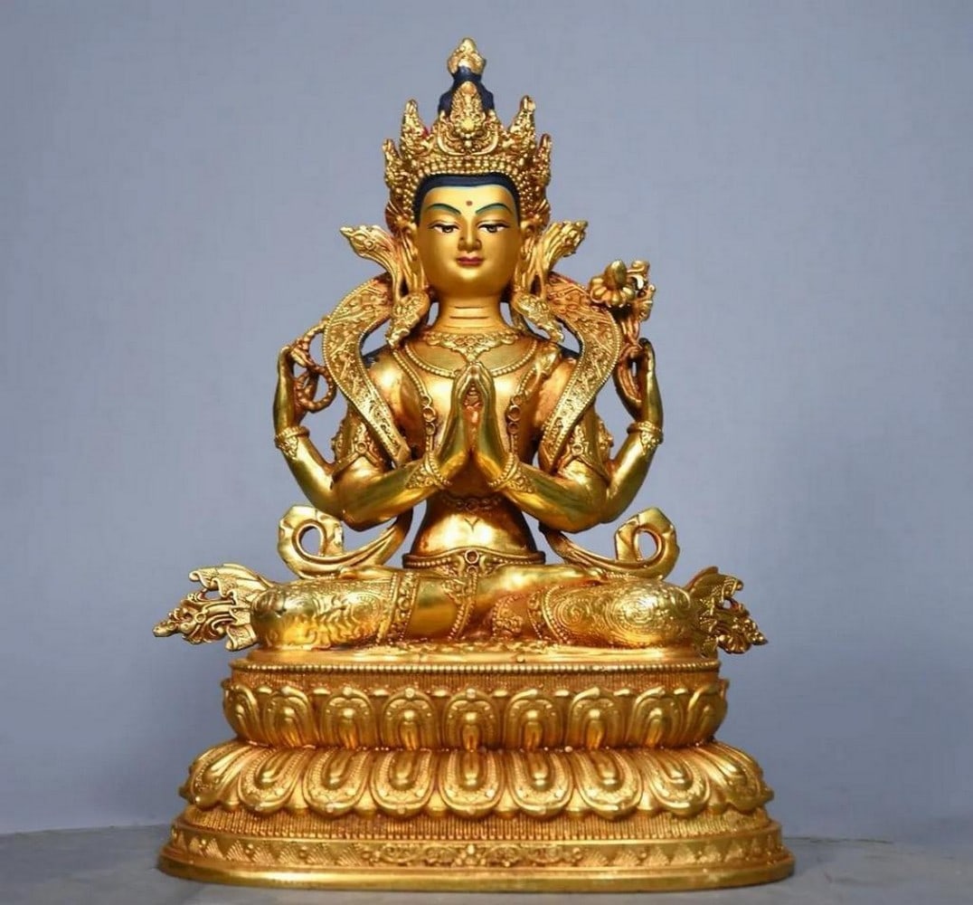 Gilded Copper Four-Armed Tara Guanyin Buddha Statue: Gilded Copper Four-Armed Tara Guanyin Buddha Statue This exquisite statue combines the compassion of Tara and Guanyin, depicted with four arms and a serene presence. Handcrafted from pure copper and b