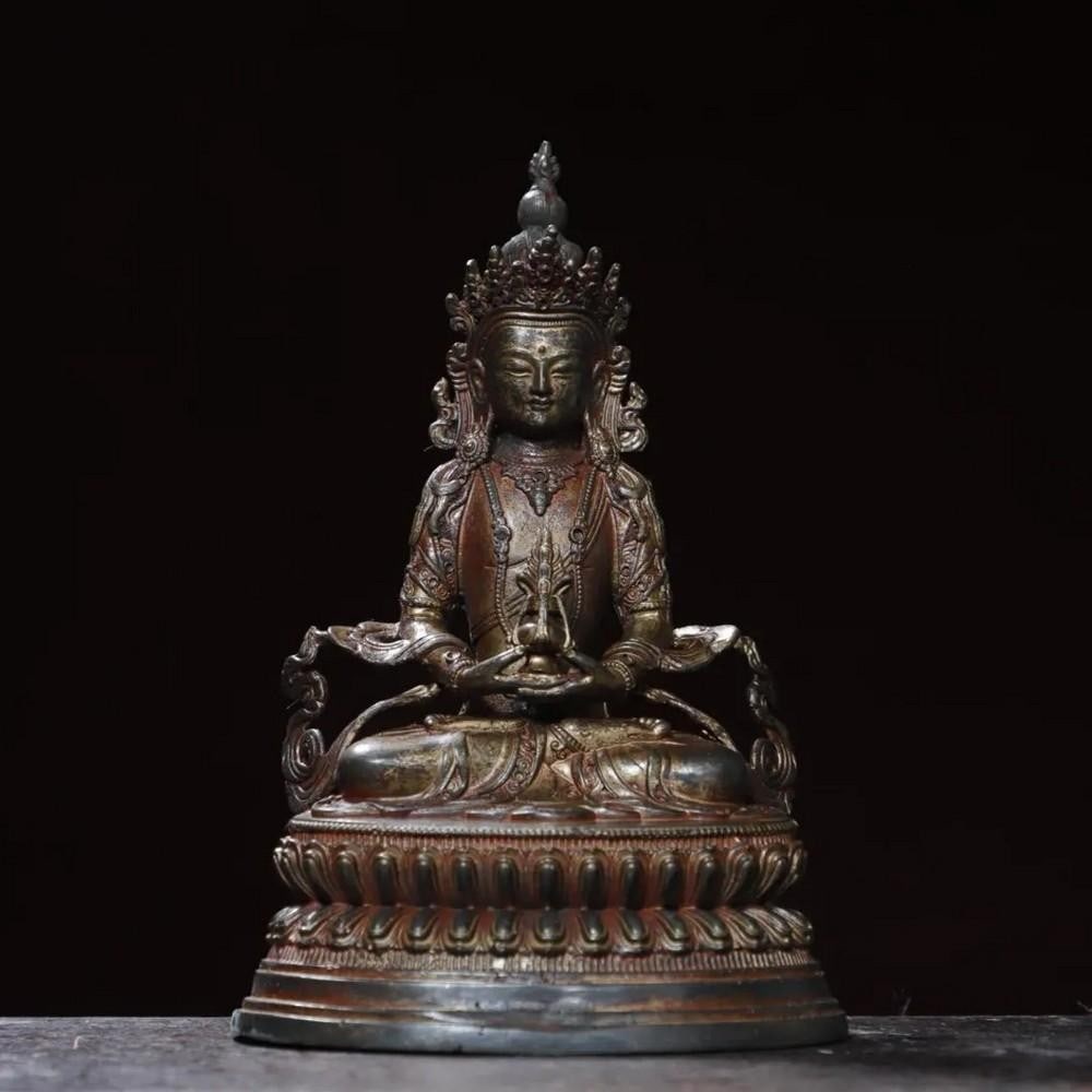 Mud Gold Sakyamuni Buddha Statue: Mud Gold Sakyamuni Buddha Statue This rare and exquisite statue of Sakyamuni Buddha, the founder of Buddhism, is handcrafted from pure copper and adorned with a unique mud gold finish. The intricate d
