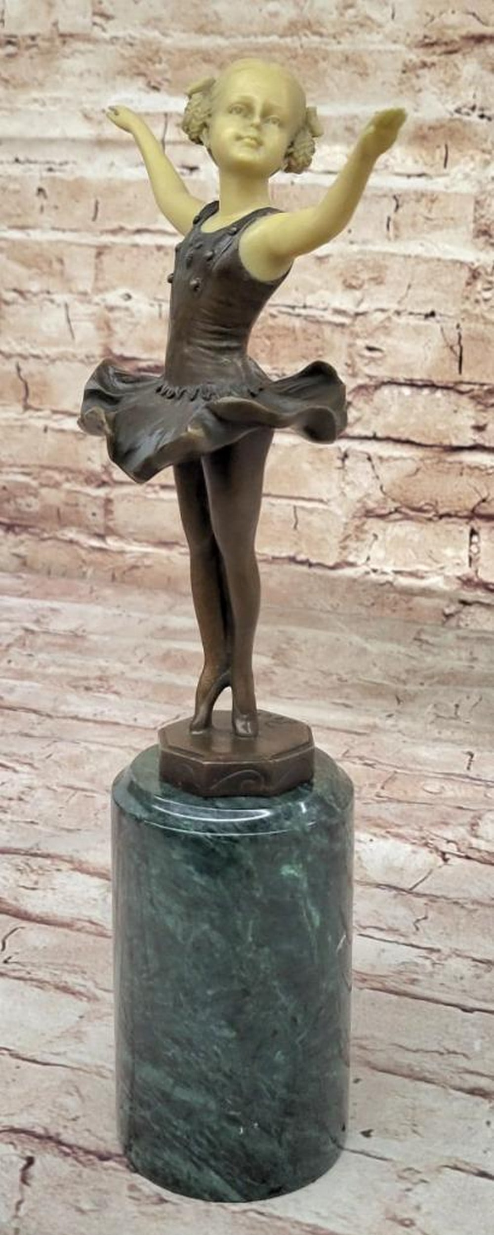 Young Ballerina Dancer on Marble Base Inspired Bronze Statue - 13" x 6.5": Young Ballerina Dancer on Marble Base Inspired Bronze Statue - 13" x 6.5" A young girl takes center stage, dancing with youthful joy and elegance. Arms raised gracefully, she twirls on her t