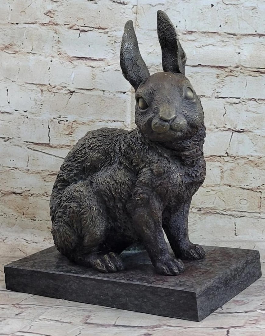 Bunny Rabbit Bronze Sculpture: Bunny Rabbit Bronze Sculpture This cute lil fellow looks up with the sweetest look. This little rabbit is the perfect touch of décor for a sweet and cute look. His ears are long and he sits on his h