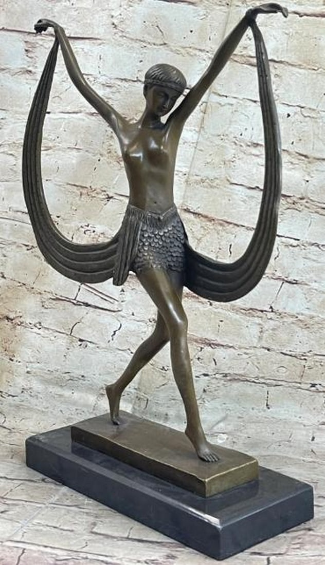 Ribbon Dance: Topless Female Dancer Bronze Sculpture: Ribbon Dance: Topless Female Dancer Bronze Sculpture Radiating movement and grace, this captivating bronze sculpture features a topless female dancer caught mid-performance, her body poised in an exp