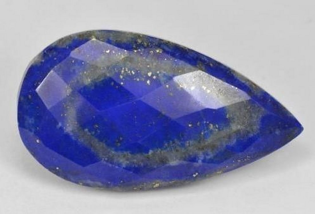 Electric Blue Lapis Lazuli Pear Rose-Cut Gemstone: Electric Blue Lapis Lazuli Pear Rose-Cut Gemstone Striking and saturated, this electric blue Lapis Lazuli features a unique pear-shaped rose cut that enhances its rich color and natural texture.
