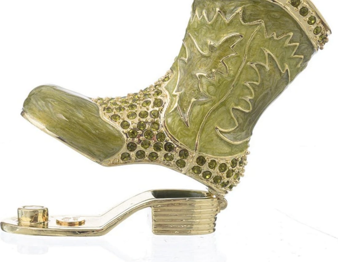 Green Boot Trinket Box: Green Boot Trinket Box This trinket box features hand picked and precisely placed Austrian crystals. It has a magnetic fastener to secure the closure. Dimensions: 2.25"L x 2.55"H x