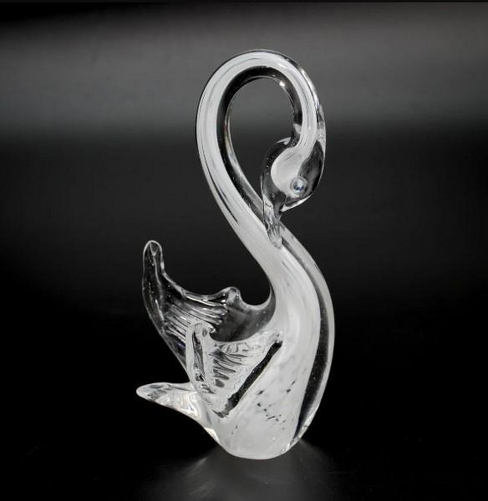 White Swan Figurine: White Swan Figurine Graceful and serene, this White Swan figurine is handcrafted using the Sommerso technique, a hallmark of Murano glass artistry. Layers of luminous white glass are encased in