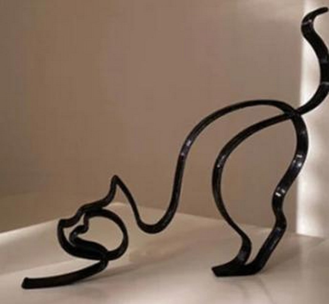 Poised to Pounce: Iron Cat Outline Sculpture: Poised to Pounce: Iron Cat Outline Sculpture Elegant in form and full of tension, this minimalist iron sculpture captures a cat in the split-second before the leap. Formed from a continuous metal out