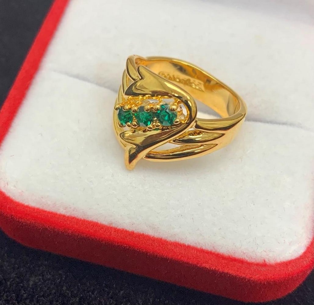 Gold Ring Inset 3 Green Gemstones On A Woven Banded Crown: Gold Ring Inset 3 Green Emerald Gemstones On A Woven Banded Crown. Emeralds are unique stones with unique capabilities. They are known to improve and enhance clairvoyance, helping one to perhaps tune