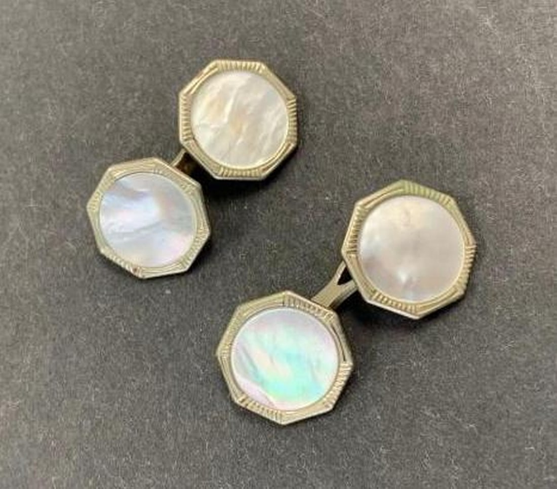 Octagon Cufflinks: Octagon Cufflinks Elevate your formal style with these refined octagon cufflinks featuring a sleek silver-tone metal frame and a radiant, pearl-like iridescent center. The geometric shape adds a