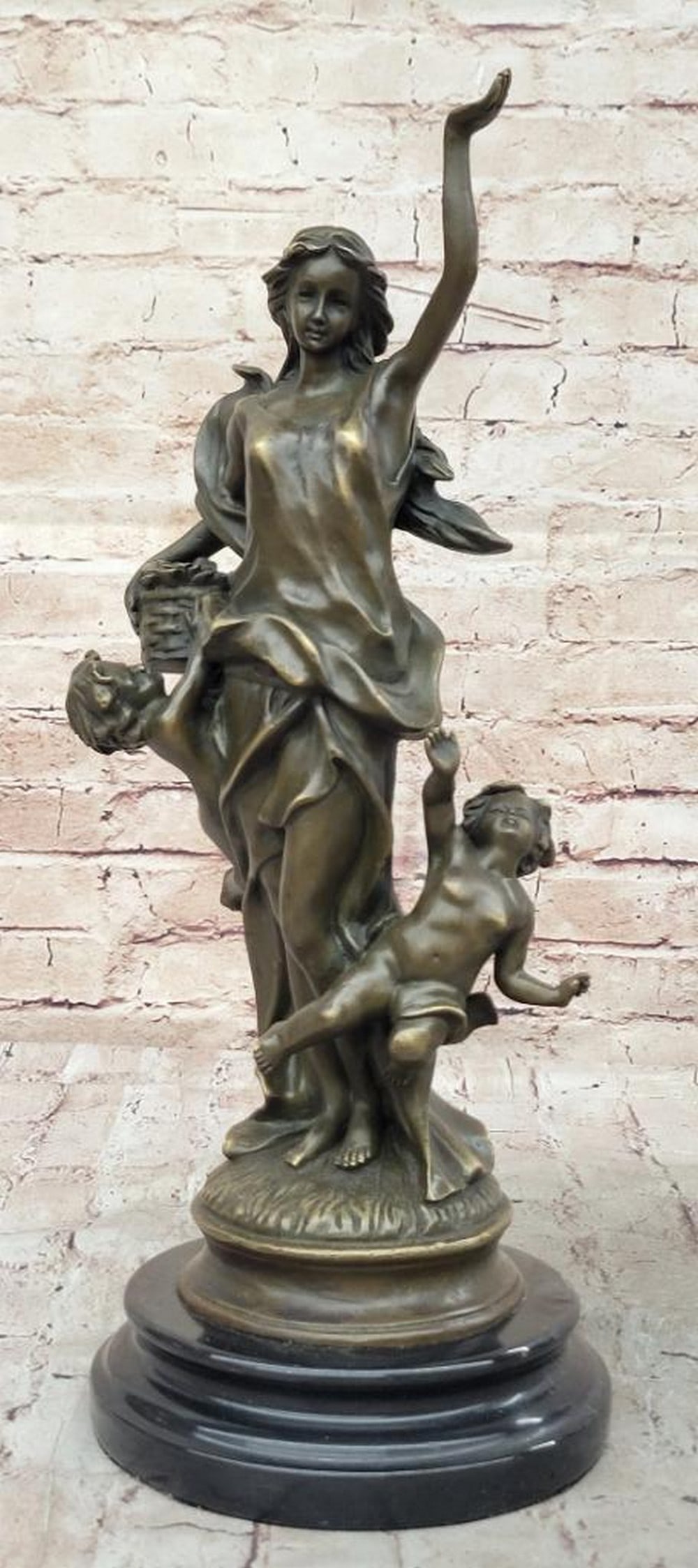 Motherhood in Nature Bronze Sculpture by Milo - 16" x 6": Motherhood in Nature Bronze Sculpture by Milo - 16" x 6" This stunning bronze sculpture by Milo captures the essence of motherhood, depicting a serene woman lovingly interacting with her playf