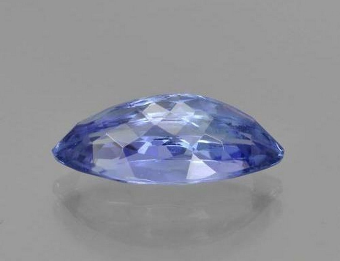 3.03 ct Violet Blue Tanzanite, Marquise Cut, VS, Tanzania: 3.03 ct Violet Blue Tanzanite, Marquise Cut, VS, Tanzania Natural tanzanite gemstone weighing 3.03 ct, cut in a striking marquise facet shape with a vivid violet-blue color. The gem measures 13.85 x 6