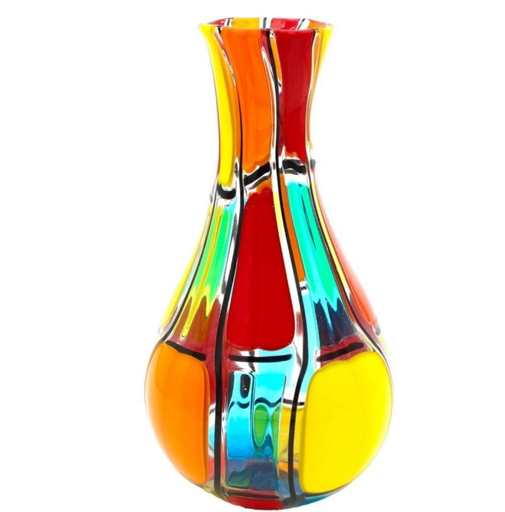 Multicolor Puzzle Vase – Murano Glass: Multicolor Puzzle Vase – Murano Glass This Venetian glass centerpiece vase is handcrafted using the glass-blowing technique, featuring multicolored glass spots and mosaic detailing. Signed by the gl