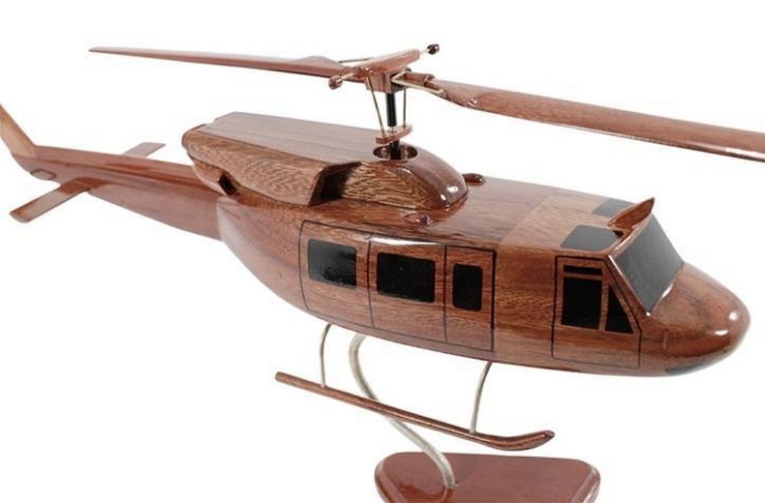 Bell 212/UH-1N Helicopter: Bell 212/UH-1N Helicopter The Bell 212 Helicopter, which also did military duty as the UH-1 N, is wonderfully replicated in this handcrafted model made to scale from solid mahogany. Exceptionally det