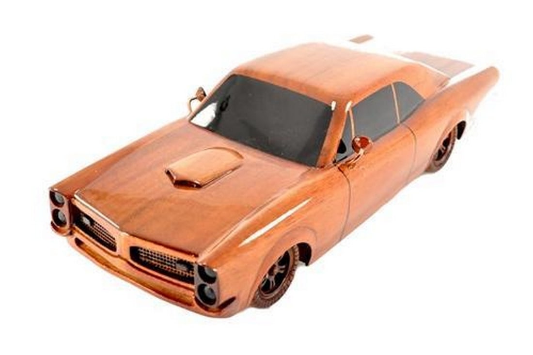1966 GTO: 1966 GTO This scale model replica of the 1966 GTO makes a great gift for the classic car enthusiast. Hand crafted from solid mahogany, this model is exceptionally detailed, has movable wheels, and is