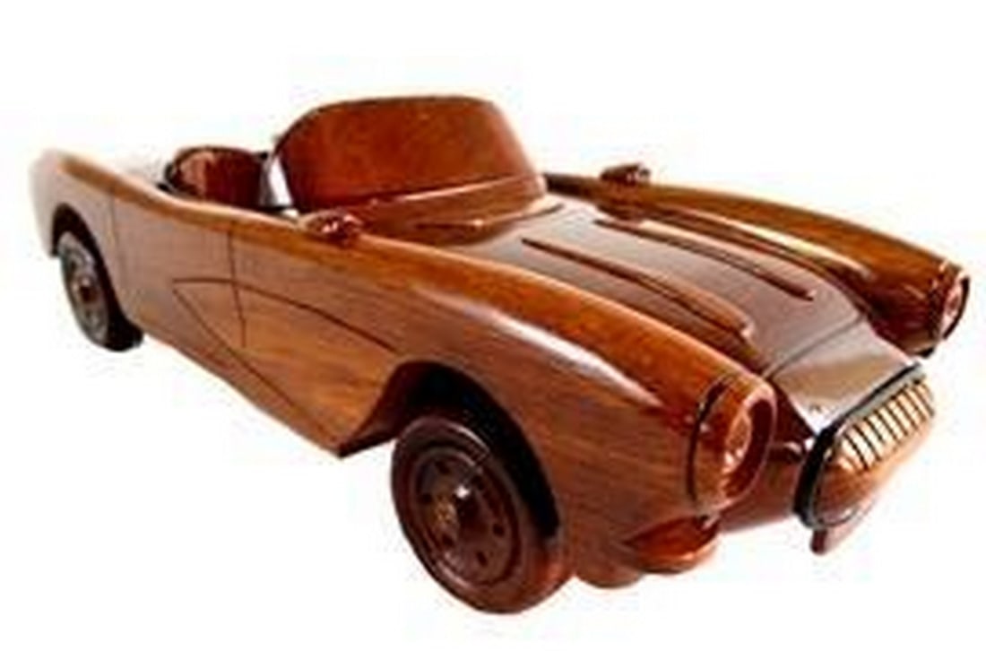 Wooden Classic: 1957 Mahogany Corvette Convertible: Wooden Classic: 1957 Mahogany Corvette Convertible With Moveable Wheels! A stunning tribute to automotive history, expertly crafted from rich mahogany wood. This exquisite piece captures the iconic li