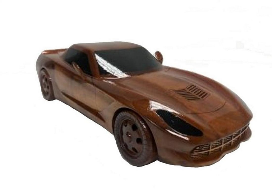 Handcrafted Mahogany 2018 Corvette Scale Model: Handcrafted Mahogany 2018 Corvette Scale Model This finely crafted scale model of the 2018 Corvette is made from solid mahogany and features movable wheels. Finished with multiple coats of