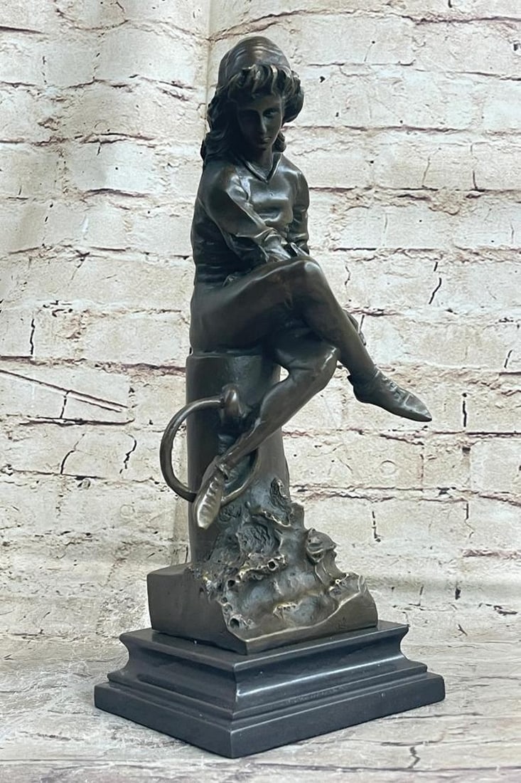 Young Girl Reading Book Bronze Sculpture - 14" x 5": Young Girl Reading Book Bronze Sculpture - 14" x 5" The young girl ca be envisioned sitting with legs crossed on the mooring bollard upon a dock of a seaport. She sits arranging a string tied