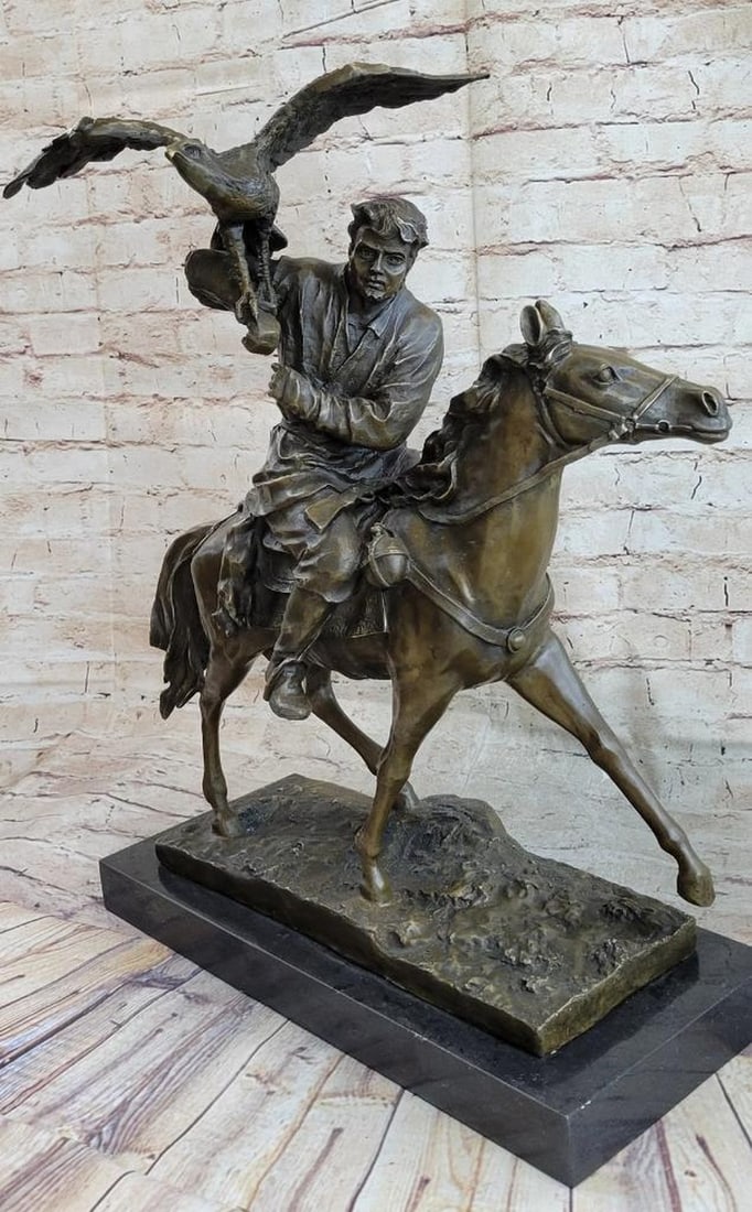 Hunter on Horseback with Eagle Bronze Sculpture by E. Nahcepe – 21" x 21": Hunter on Horseback with Eagle Bronze Sculpture by E. Nahcepe – 21" x 21" This reproduction bronze sculpture depicts a rugged hunter on horseback moving through open terrain, accompanied by