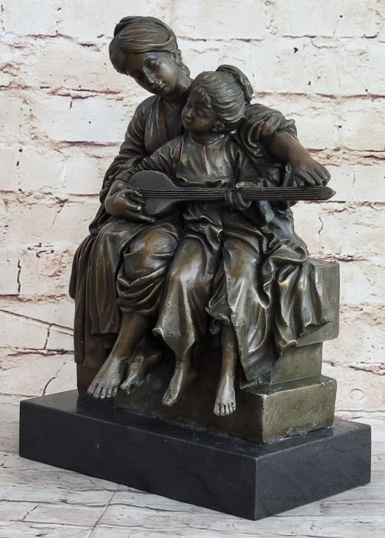Mother & Child Strumming Guitar Bronze Sculpture: Mother & Child Strumming Guitar Bronze Sculpture A young girl sits against her mother as the mom teachers how to play the instrument. The young girl is eagerly fiddling with the strings as her mo