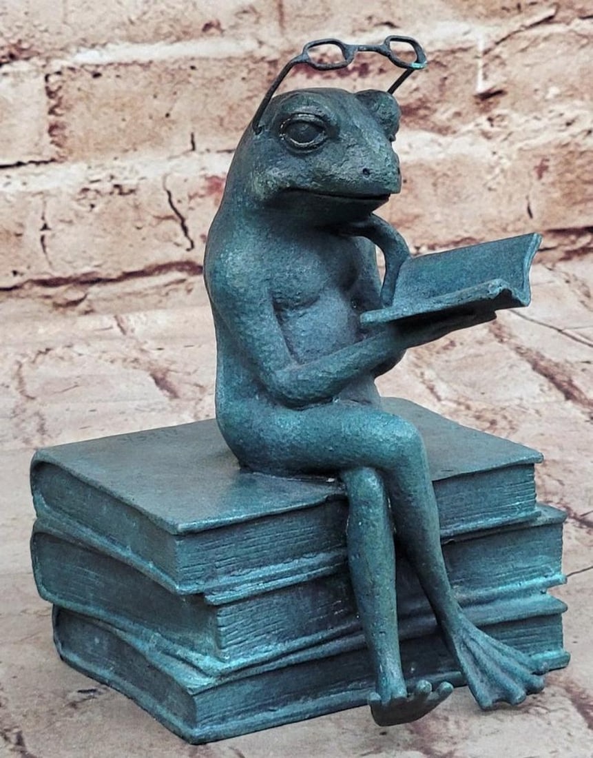 Miniature Reading Frog Bronze Sculpture by Nick - 6" x 5": Miniature Reading Frog Bronze Sculpture by Nick - 6" x 5" Presenting our adorable Miniature Frog sculpture, guaranteed to melt your heart! This endearing Reading Frog is a captivating accent f