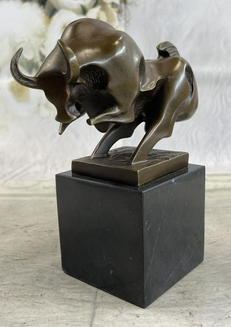 Abstract Modern Charging Bull Bronze Sculpture: Abstract Modern Charging Bull Bronze Sculpture This magnificent modern and abstract sculpture is of a charging bull. With his head down, his nostrils` flared and his muscles ti