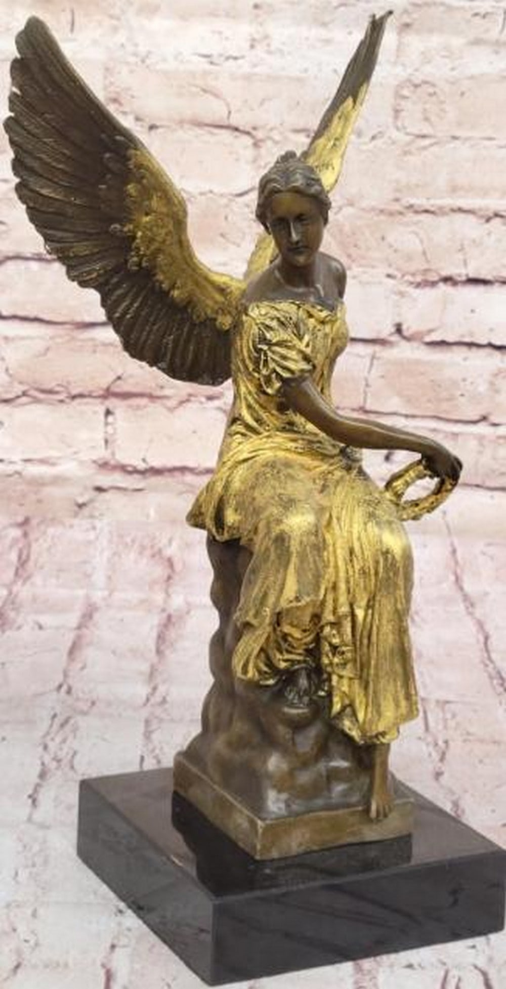 Golden Angel Bronze Sculpture: Golden Angel Bronze Sculpture The beautiful angel sits upon her celestial throne having surveyed an earthly battle. She is captured in the likeness of ancient Roman/Hellenistic representa