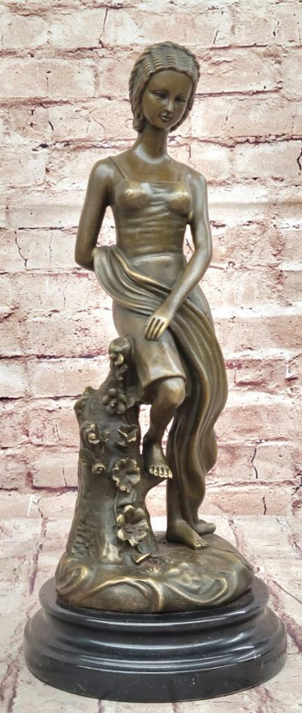 Young Girl Sitting on a Tree Near a Pond Bronze Sculpture by Milo - 14.5" x 6": Young Girl Sitting on a Tree Near a Pond Bronze Sculpture by Milo - 14.5" x 6" This captivating bronze sculpture by Milo depicts a young girl serenely perched on a tree branch, overlooking a t