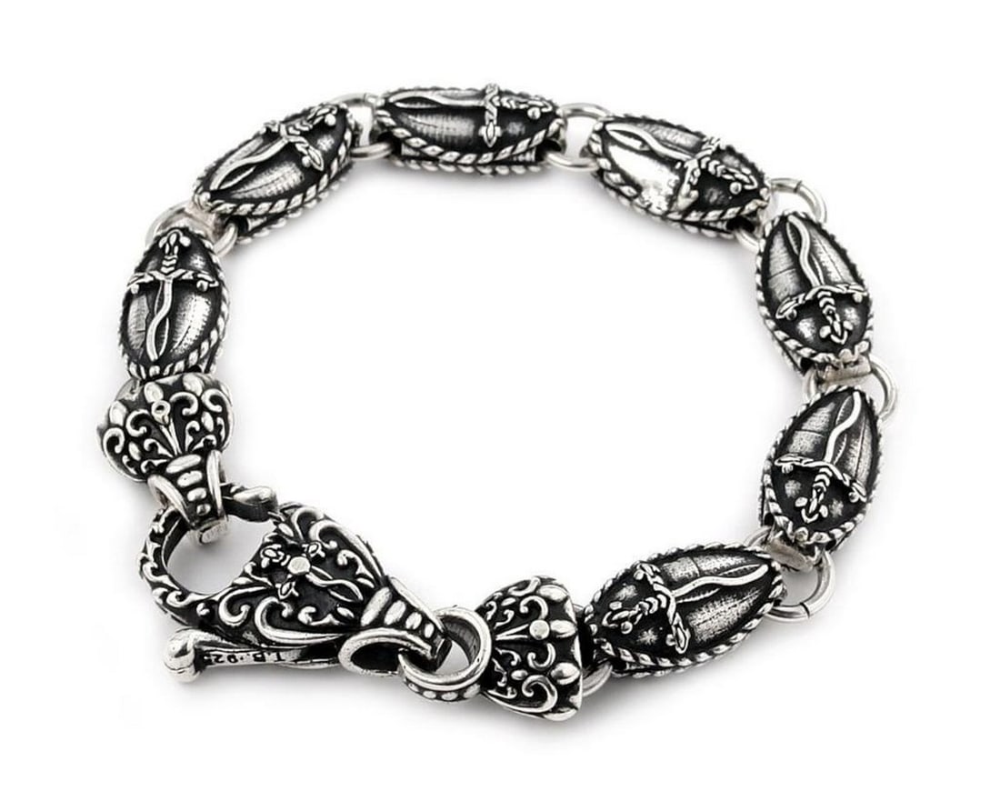 Twisted Blade Silver Large Oval Dagger Bracelet with Clasp: Twisted Blade Silver Large Oval Dagger Bracelet with Clasp Twisted Blade is made from .925 Sterling Silver, featuring a large oval dagger link bracelet that is hand-crafted to absolute perfection. W