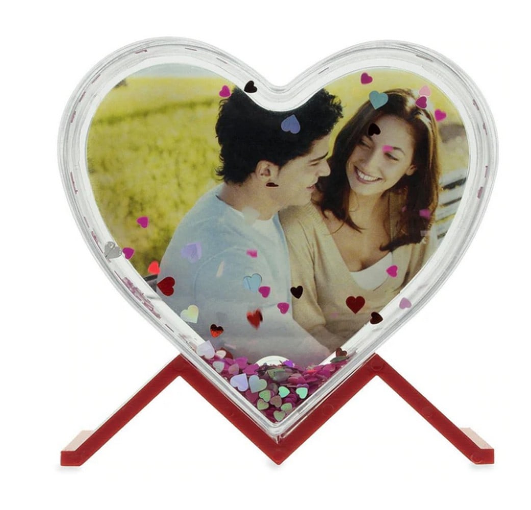 Heart Shape Clear Acrylic Plastic Water Globe Picture Frame: Heart Shape Clear Acrylic Plastic Water Globe Picture Frame. -Acrylic Plastic Globe -You Can Replace Picture with your Own -Contains Sparkling Pink and Silver Hearts Dimensions: 3.9 Inches Tall x 4