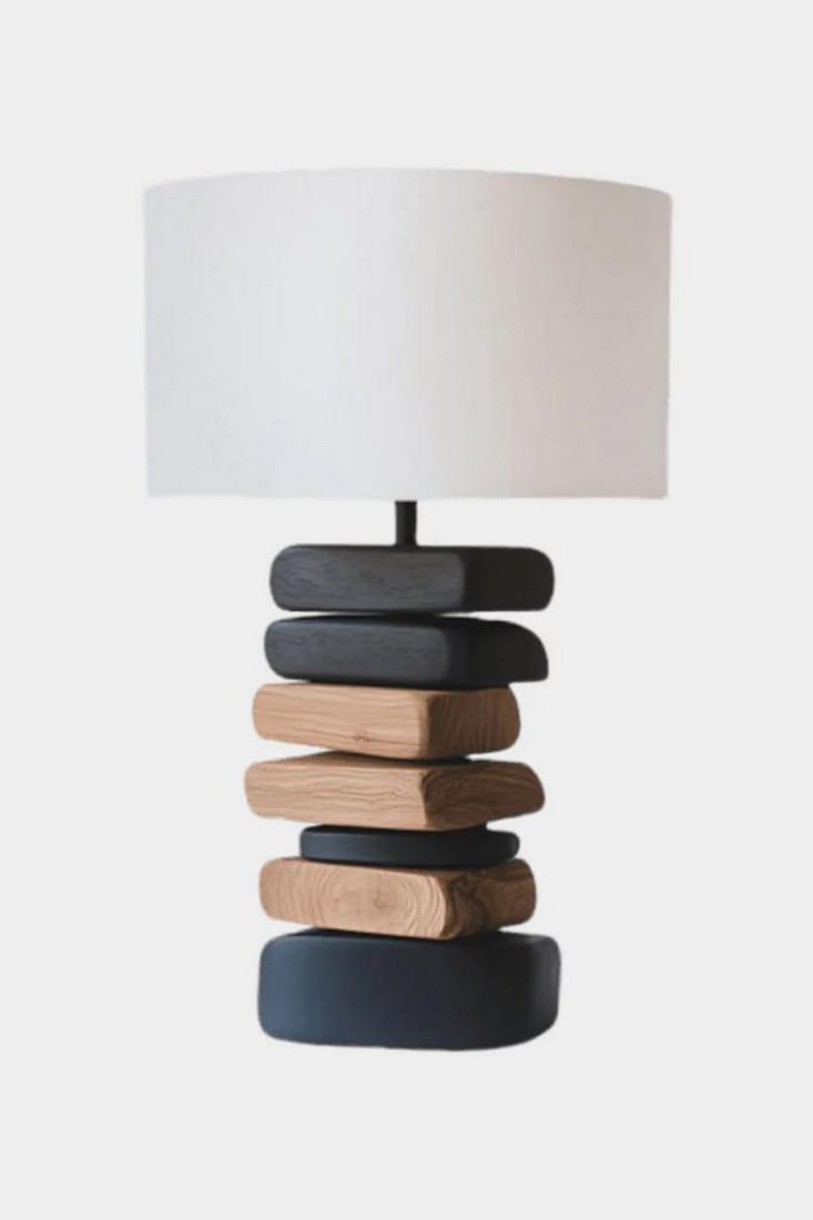 Contemporary Stacked Wood Table Lamp: Contemporary Stacked Wood Table Lamp Sculptural and serene, this handcrafted table lamp features a stacked base of rounded rectangular forms—alternating between natural wood tones and deep matte bla