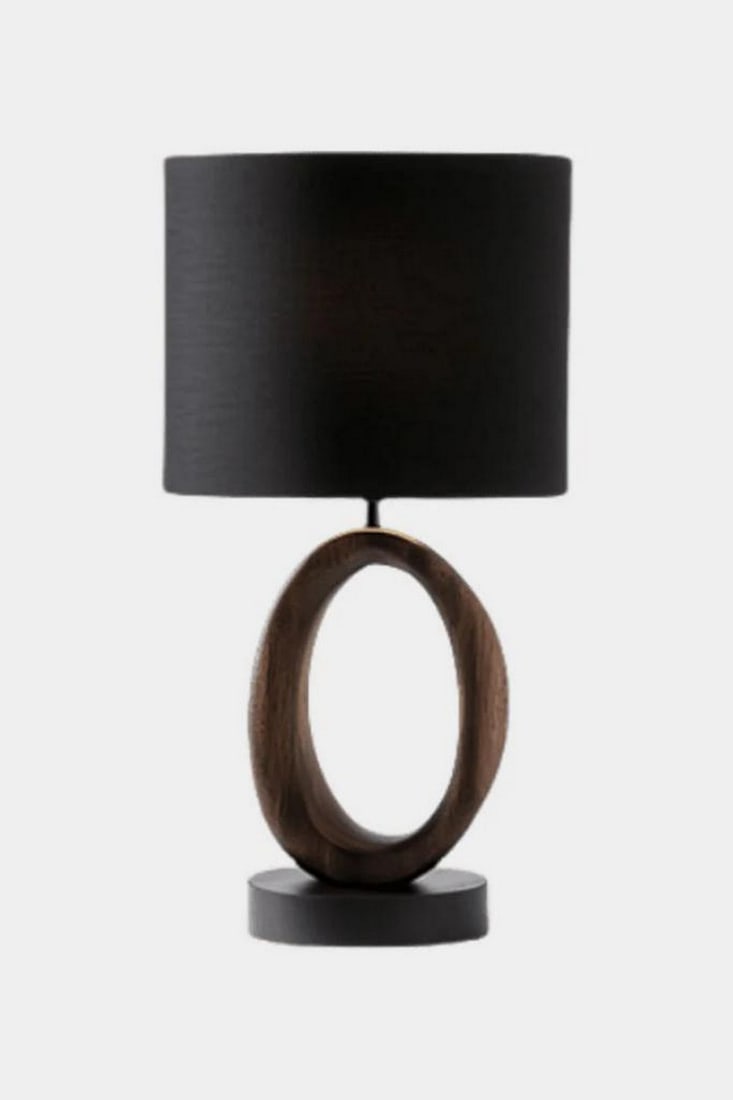 Contemporary Circular Wood Table Lamp: Contemporary Circular Wood Table Lamp Artful and refined, this modern table lamp features a smooth, circular wooden base with an open center—evoking balance, movement, and quiet sophistication. Moun