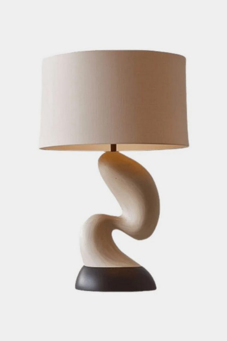 Twisted Wave Wooden Table Lamp: Twisted Wave Wooden Table Lamp Elegant and expressive, this handcrafted table lamp features a sculptural base with a fluid, wave-like twist in warm wood tones, anchored by a contrasting dark foundatio