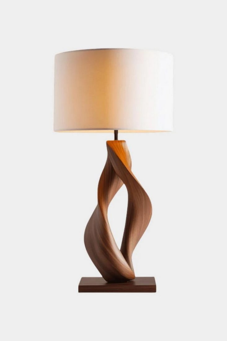 Sculpted Twist Wooden Table Lamp: Sculpted Twist Wooden Table Lamp Graceful and bold, this handcrafted table lamp features a sculptural twisted base in rich polished wood, anchored on a square platform for balance and presence. The cy