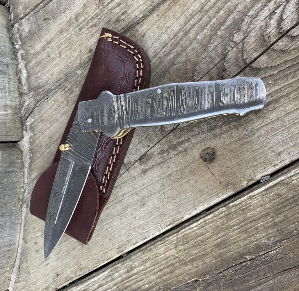 8.5" Storms Reach Folding Damascus Knife: 8.5" Storms Reach Folding Damascus Knife Embark on your outdoor adventures with our Custom Handmade Damascus Steel Hunting, Camping & Folding Knife – a true testament to masterful craftsman