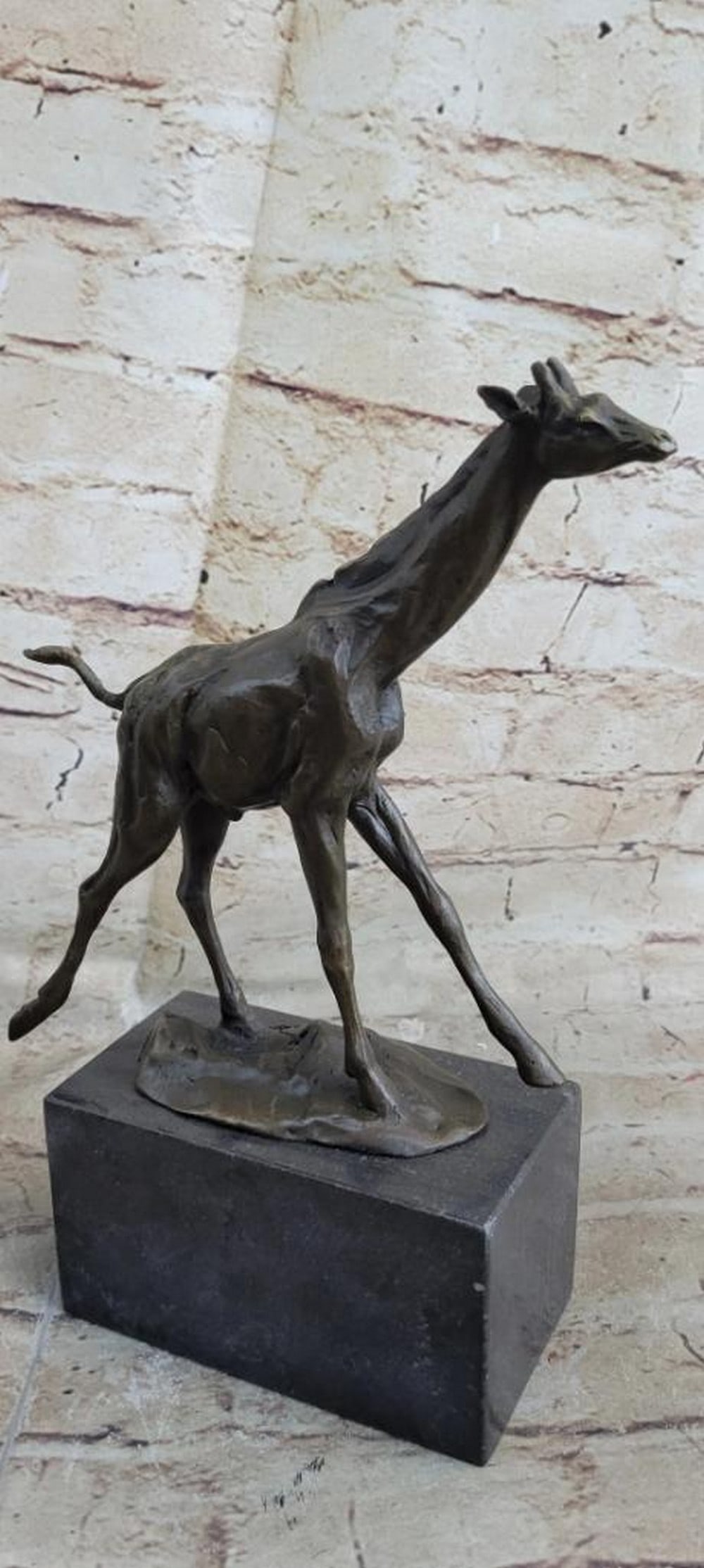 Galloping Giraffe Original Bronze Statue - 10.5" x 10": Galloping Giraffe Original Bronze Statue - 10.5" x 10" This dynamic bronze sculpture captures the essence of a giraffe in full gallop. Mounted on a sleek base, the statue’s extended legs an