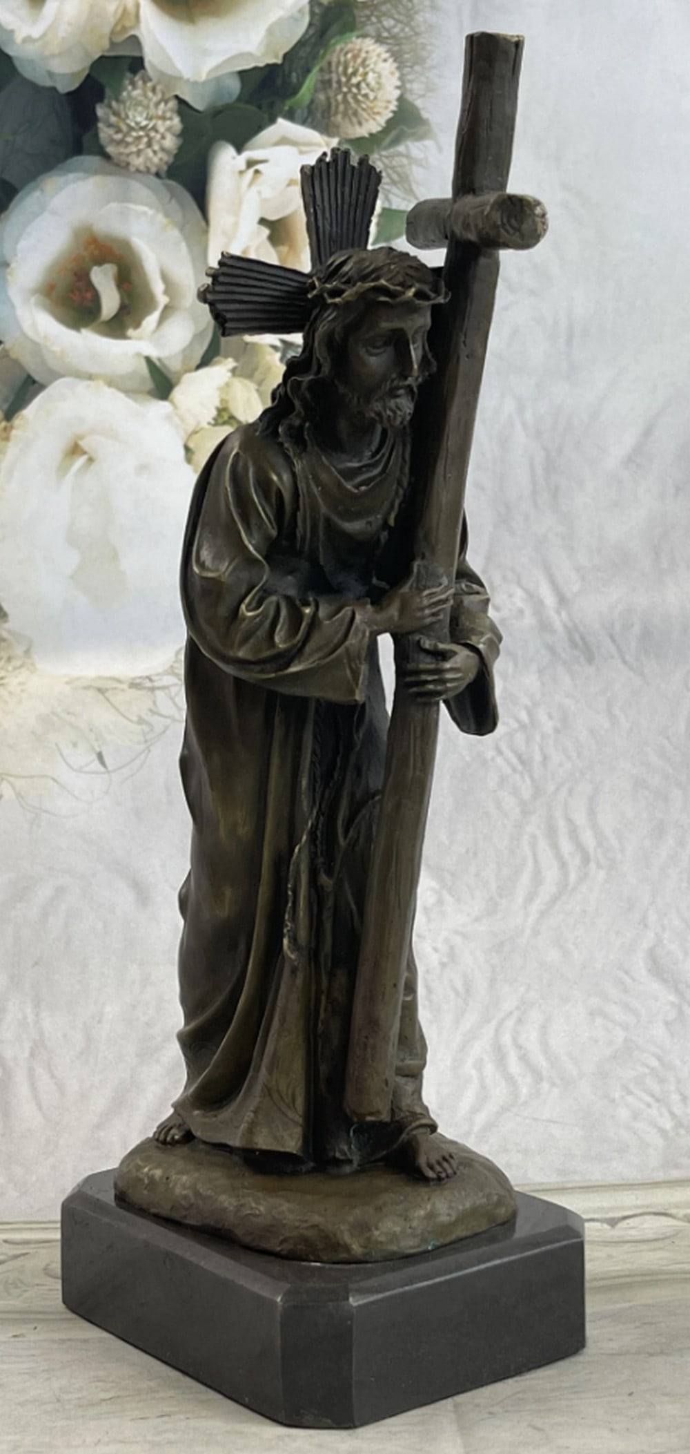 Jesus Christ Forced To Carry Cross Bronze Statue: Jesus Christ Forced To Carry Cross Bronze Statue Weary, Jesus Christ perseveres while forced to carry the cross to Calvary, where He was to be crucified. The large cross weighs down heavy on His sho