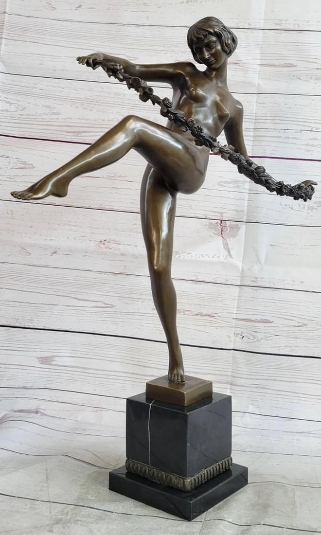 Nude Female Dancer Bronze Sculpture: Nude Female Dancer Bronze Sculpture This lovely beautiful woman stand elegantly on the ball of her right leg and balances herself with her other leg slightly bent at the knee and lifted up. She is co