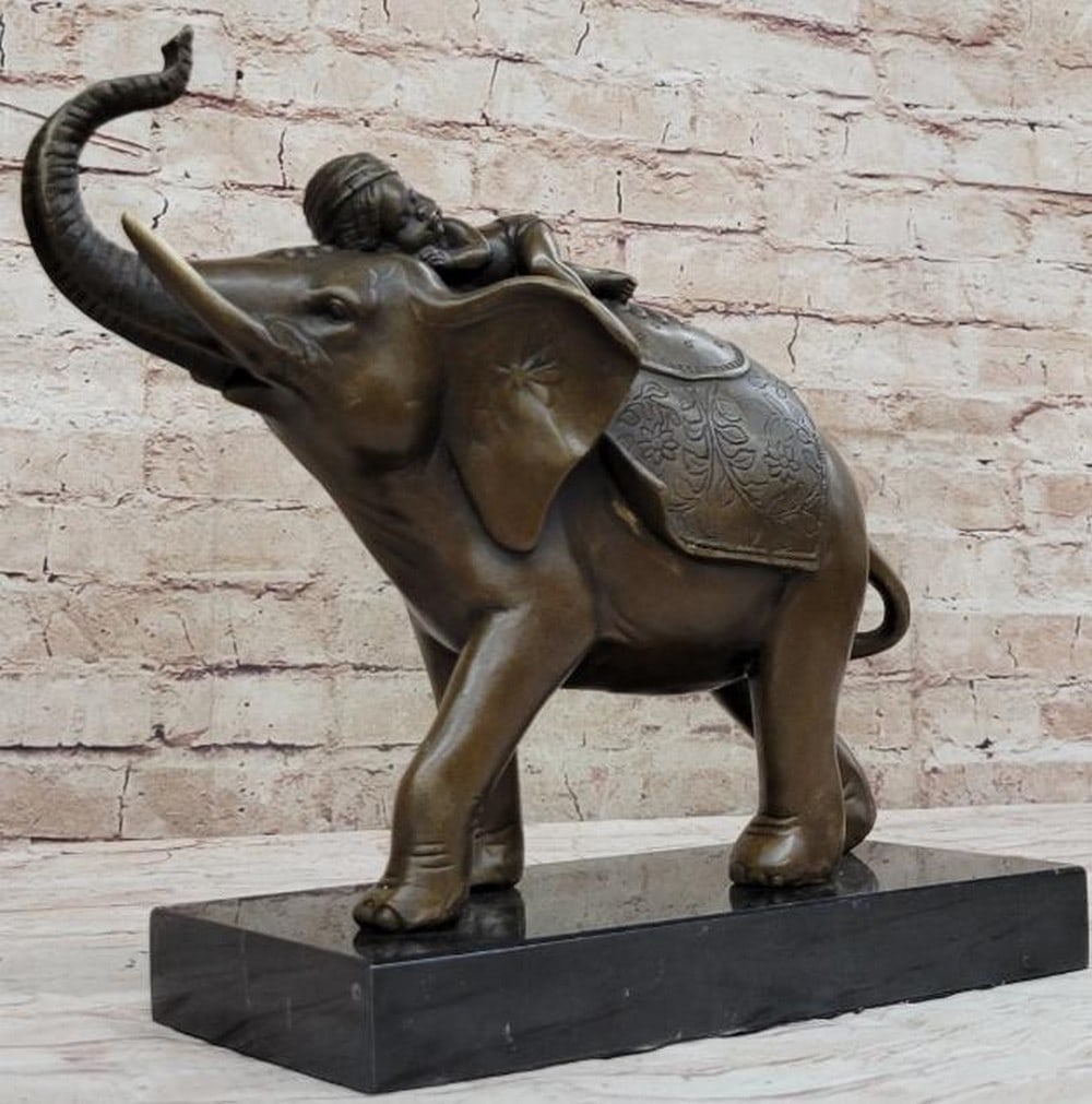 Bronze Elephant Sculpture with Sleeping Child: Bronze Elephant Sculpture with Sleeping Child This heartwarming reproduction bronze sculpture, bearing the signature of the artist Barye, captures a tender moment between strength and innocence. An e