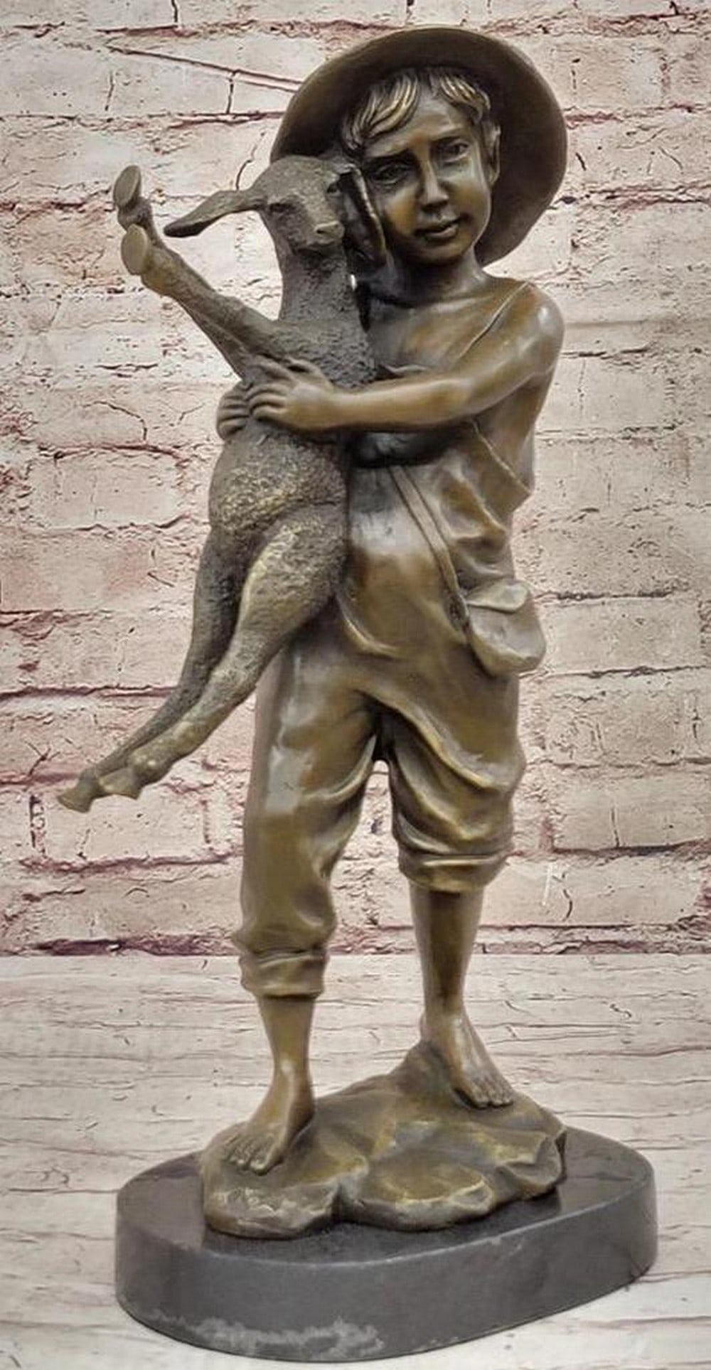 Farm boy Holding Baby Sheep Bronze Statue - 16" x 7": Farm boy Holding Baby Sheep Bronze Statue - 16" x 7" Experience the heartwarming charm of our Genuine Solid Bronze Sculpture featuring a sweet boy with a baby lamb – a perfec