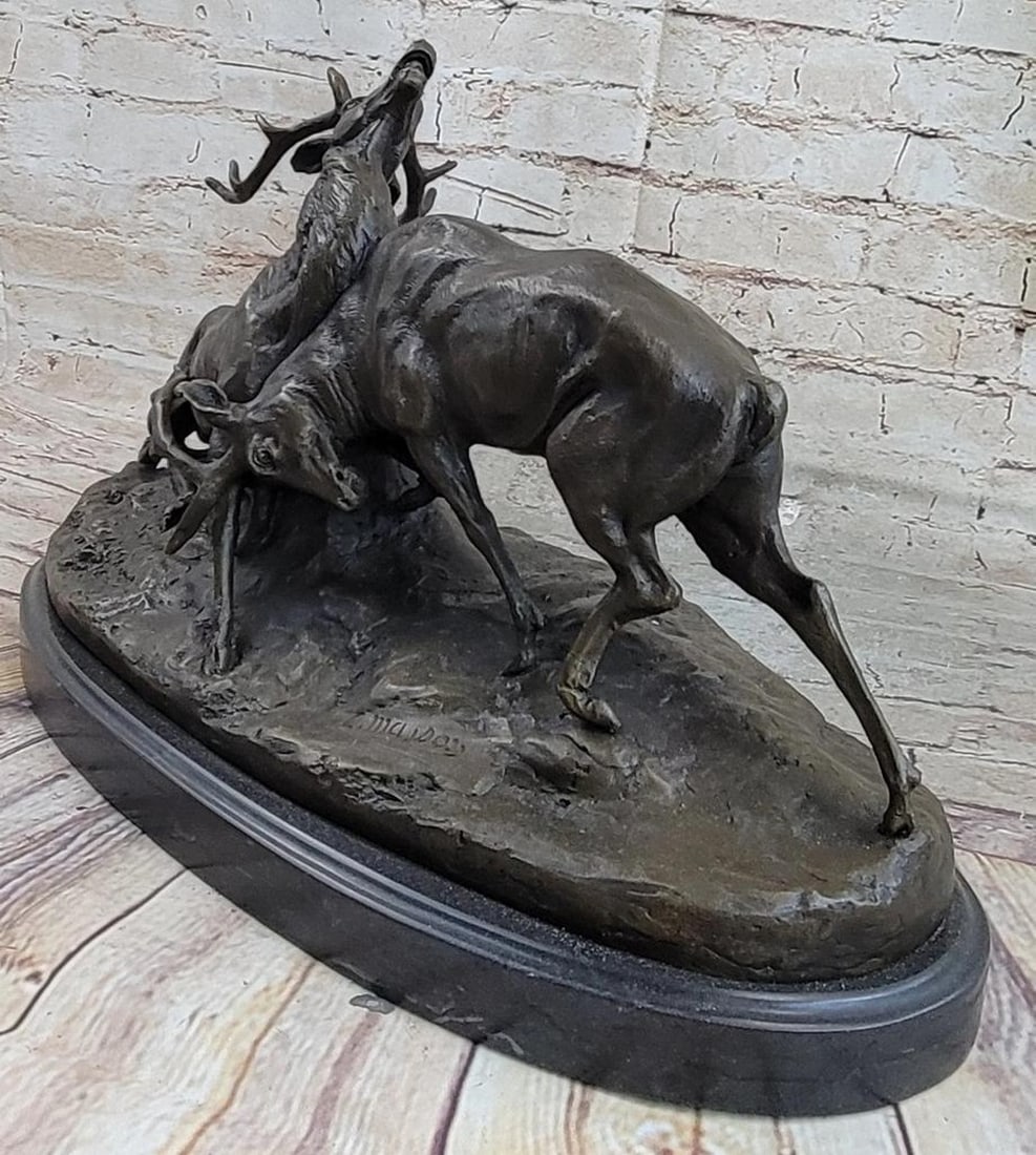 Majdoss Inspired Fighting Elk Bronze Sculpture - 11" x 17": Majdoss Inspired Fighting Elk Bronze Sculpture - 11" x 17" This is an absolute stunning animal sculpture of two fighting deer, created by C. Majdoss. The sculptor designed a scene of a battle