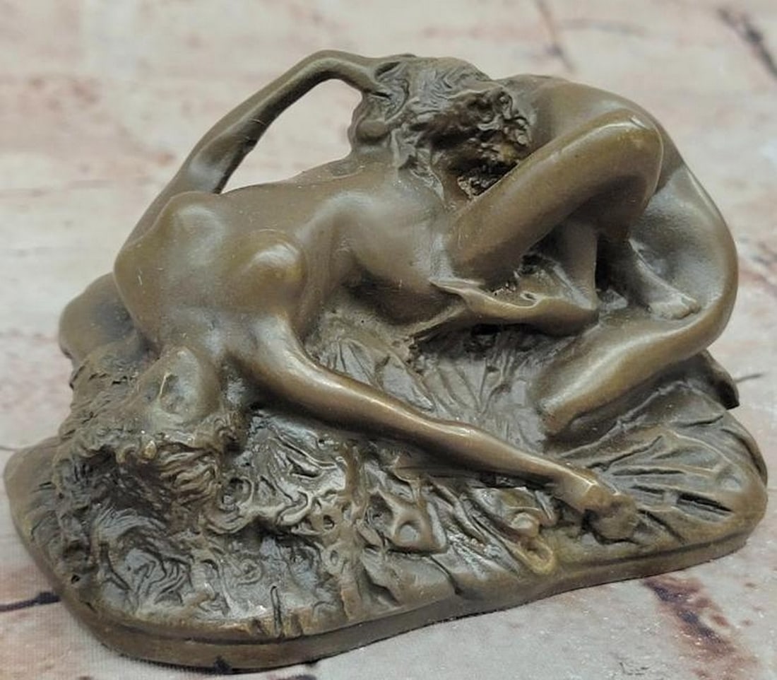 Passionate Embrace Reproduction Bronze Sculpture: Passionate Embrace Reproduction Bronze Sculpture This evocative reproduction bronze sculpture bearing the signature of artist J.M. Lambeaux, captures the intimate and sensual connection between two n