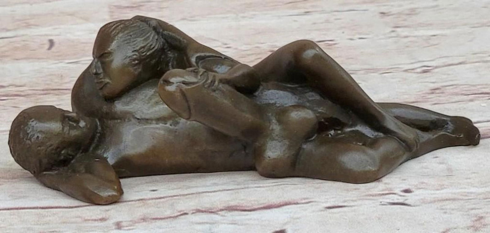 Abstract Nude Man and Woman Sculpture: Abstract Nude Man and Woman Sculpture This is an abstract bronze sculpture, bearing the signature of artist Milo, that captures the intimate connection between a man and a woman, their bodies morphin