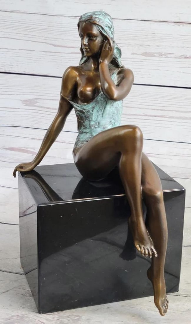 Feminine Confidence Bronze Sculpture Signed by Mavchi on Marble Base - 10" x 5": Feminine Confidence Bronze Sculpture Signed by Mavchi on Marble Base - 10" x 5" This sculpture gracefully captures the essence of feminine allure and self-assurance. Celebrating the natural cu