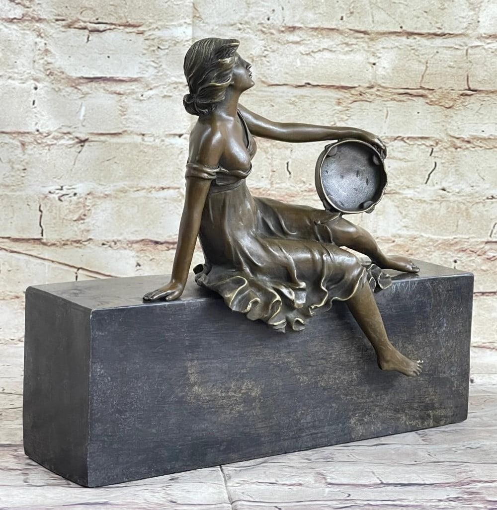 Serenity in Marble Bronze Sculpture: Serenity in Marble Bronze Sculpture A graceful woman lounges effortlessly on a marble base, her posture both relaxed and elegant. Dressed in a flowing, delicate dress, she exudes a quiet, timeless be