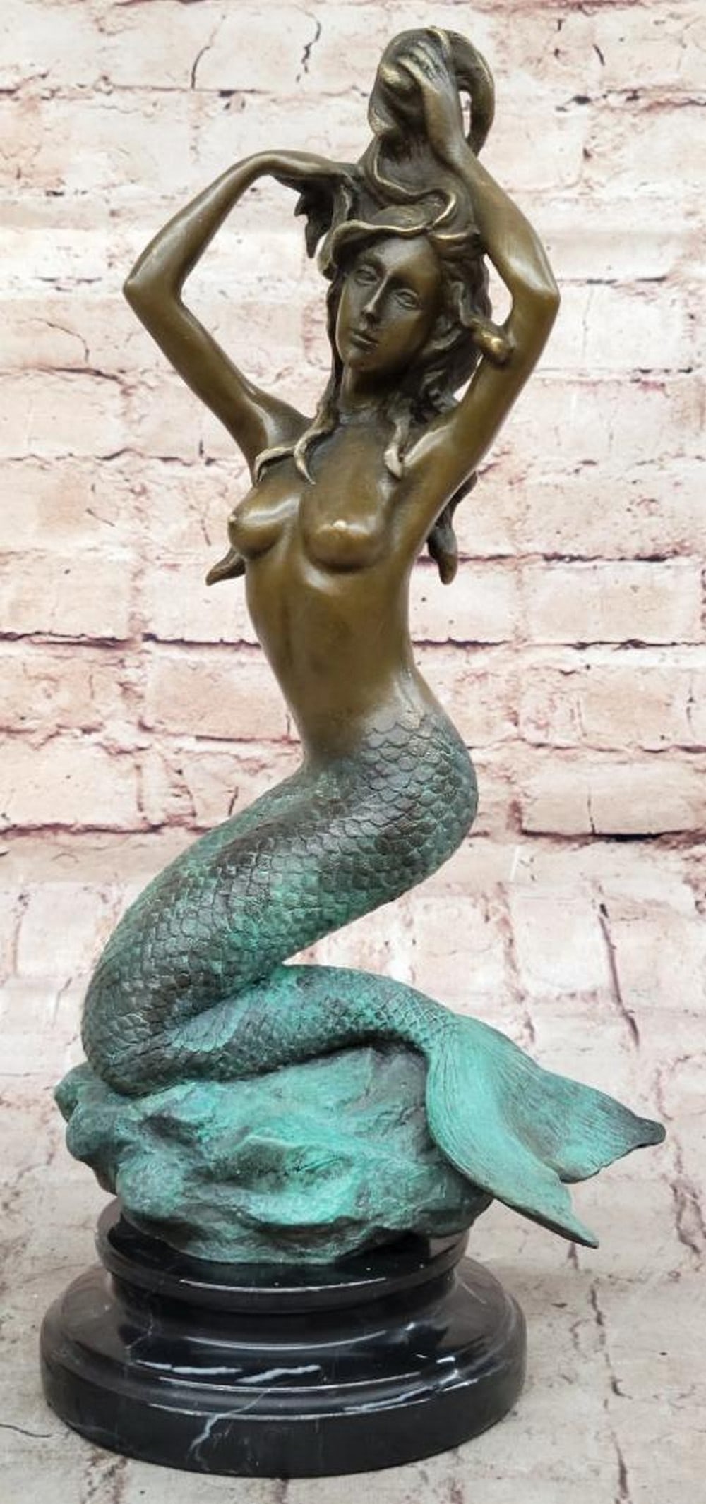 Seated Mermaid Original Bronze Statue - "13.5 x 7": Seated Mermaid Original Bronze Statue - "13.5 x 7" A captivating piece of art that beautifully captures the mythical allure of mermaids. Crafted from bronze, this statue features a mermaid ele