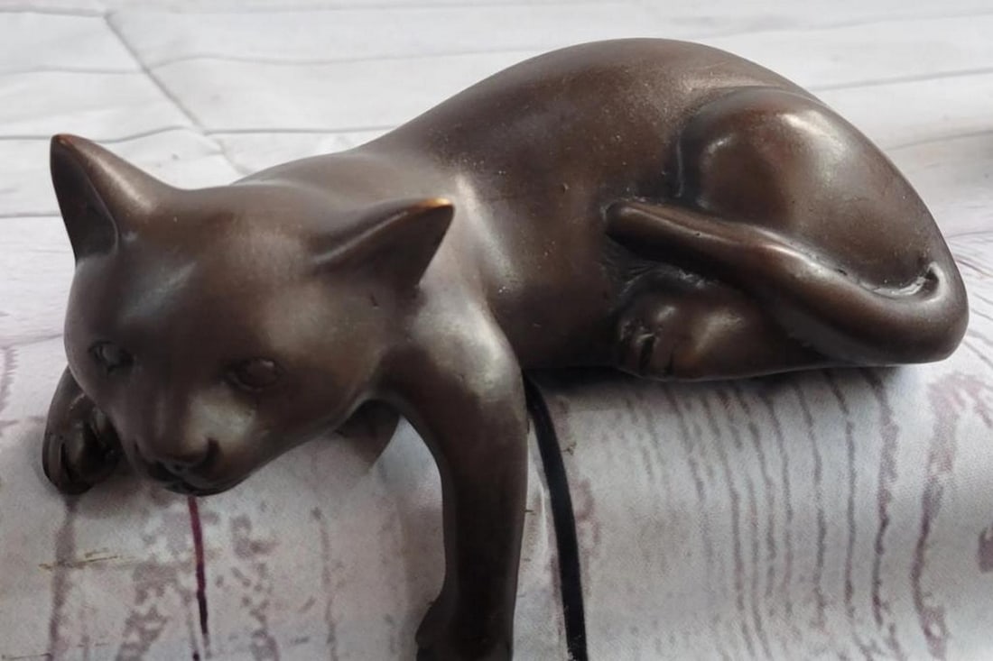 Signed Original Content Kitten Bronze Sculpture - 3" x 5": Signed Original Content Kitten Bronze Sculpture - 3" x 5" This delightful bronze sculpture captures the essence of a typical cat as it lounges on the edge of something, enjoying its surroundi