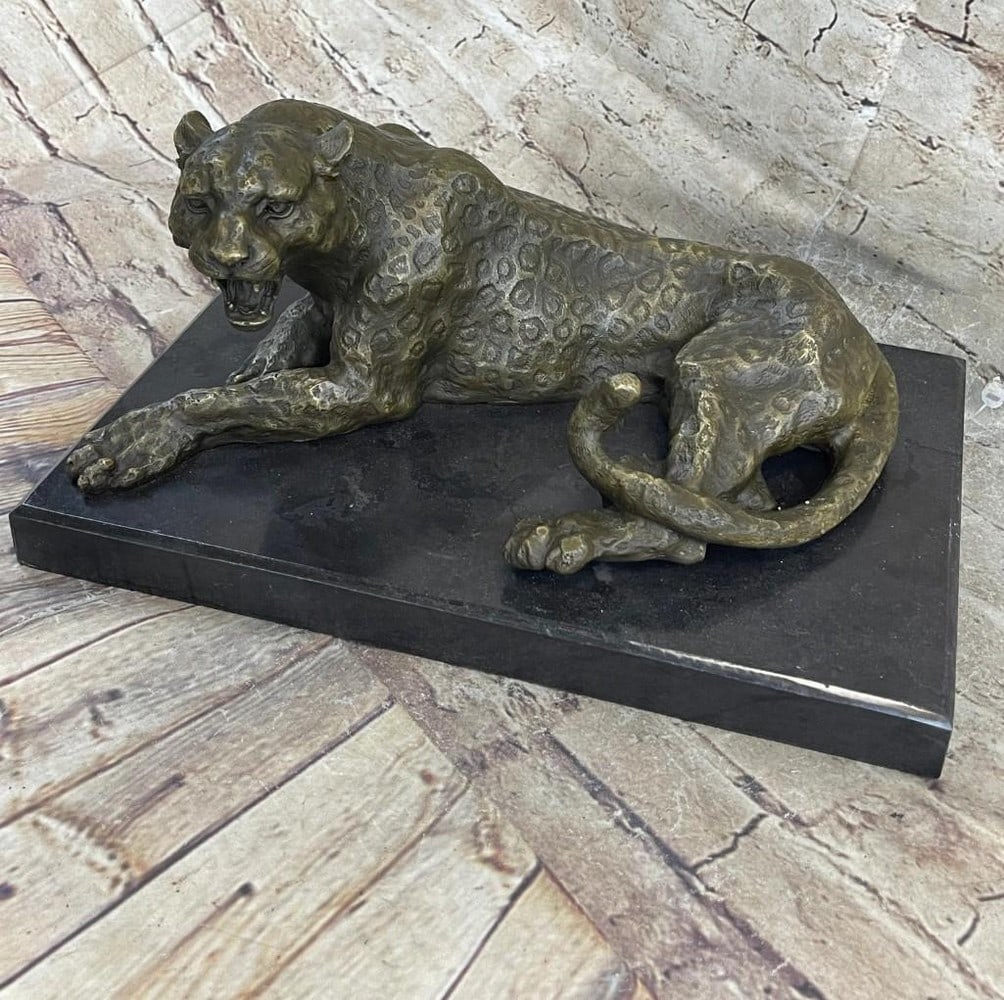 Large Leopard Bronze Sculpture: Large Leopard Bronze Sculpture The leopard, startled awake by the viewer from a afternoon nap in the shade, lets out a warning roar. It's spots are marked in exquisite details bringing the magnif