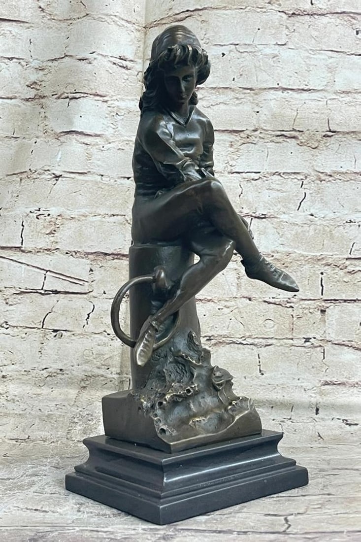 Young Girl Reading Book Bronze Sculpture - 14" x 5": Young Girl Reading Book Bronze Sculpture - 14" x 5" The young girl ca be envisioned sitting with legs crossed on the mooring bollard upon a dock of a seaport. She sits arranging a string tied