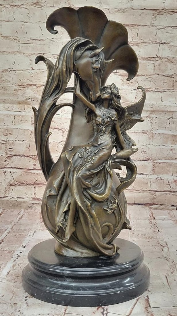 Fairy & Horse Original Bronze Statue - 17.5" x 8": Fairy & Horse Original Bronze Statue - 17.5" x 8" This enchanting bronze sculpture of a fairy with a unicorn beautifully captures the magic and wonder of a mystical forest scene. The fai