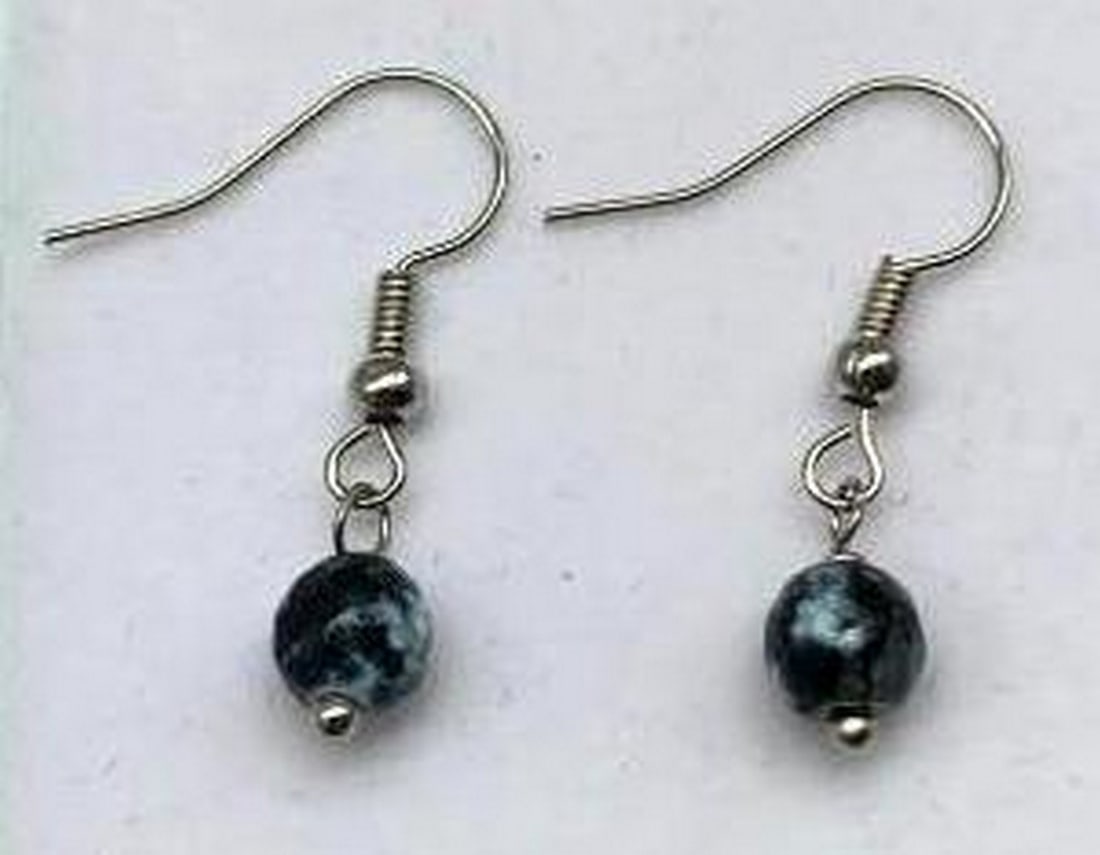 Sterling Silver Dangle Earrings with Black and White Marble Design: Sterling Silver Dangle Earrings with Black and White Marble Design These elegant dangle earrings feature gracefully suspended striking black beads with a unique white marble pattern. The contrast