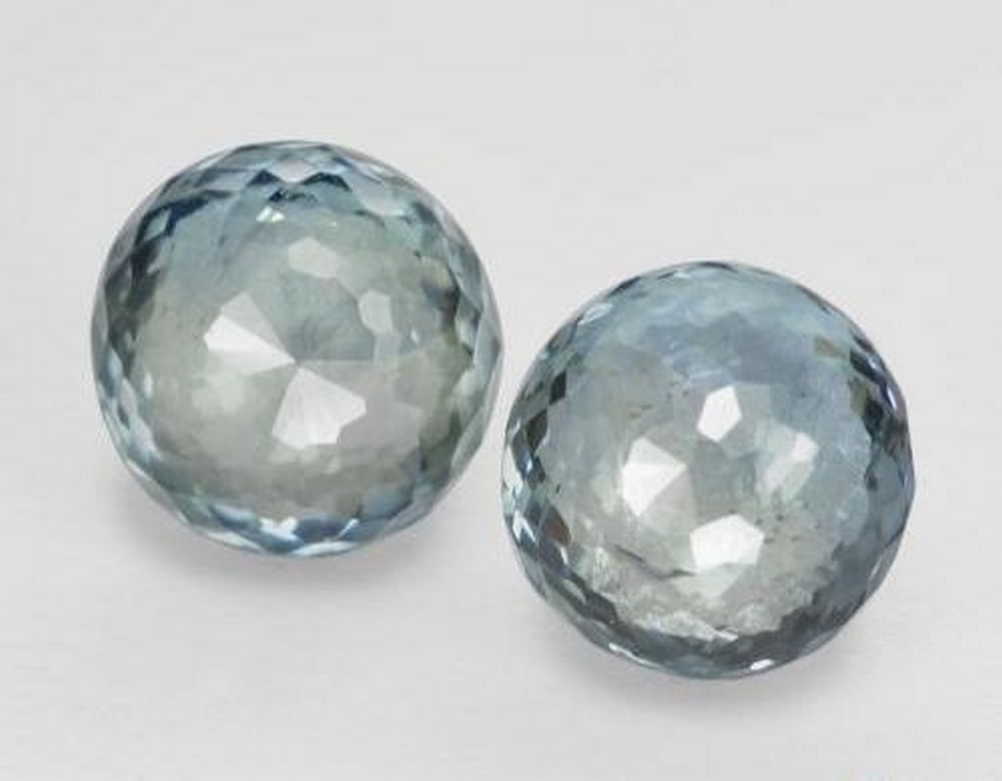 0.99 ctw Natural Green Blue Sapphire, Round Cut, VS, Tanzania: 0.99 ctw Natural Green Blue Sapphire, Round Cut, VS, Tanzania Pair of natural sapphire gemstones with a combined weight of 0.99 carats (average 0.50 carats each), cut in round mixed facet shape with a
