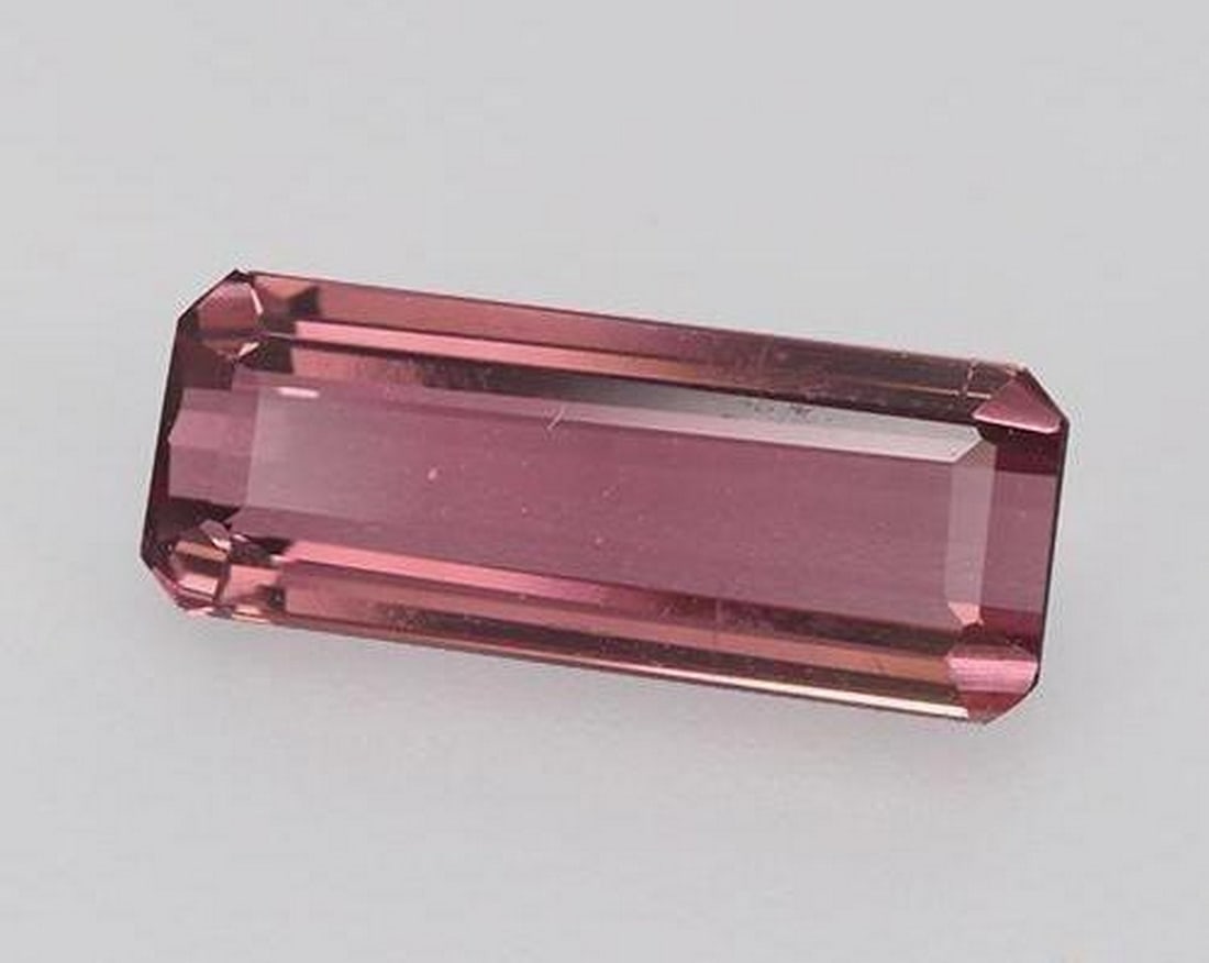 1.56 ct Natural Deep Magenta Tourmaline, Octagon/Emerald Cut, VVS, Mozambique: 1.56 ct Natural Deep Magenta Tourmaline, Octagon/Emerald Cut, VVS, Mozambique Natural tourmaline gemstone weighing 1.56 carats, cut in an octagon step (emerald) shape with a deep magenta color. The ge